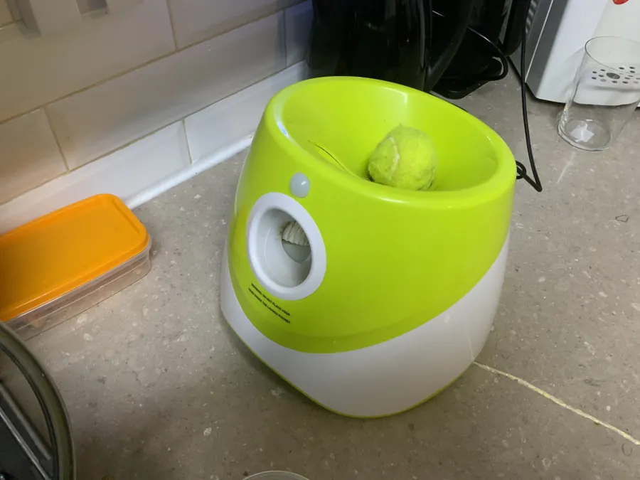 The launcher with a ball sitting in the chute